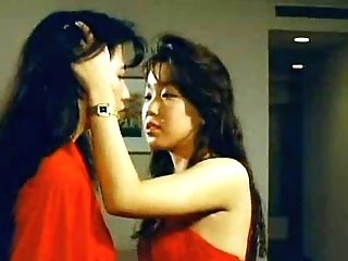 Japanese lesbos and a big fake penis dick