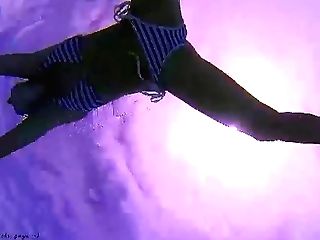 Amazing Underwater Swimsuit Display. Elegant Limber Babe Swimming Underwater In The Pool